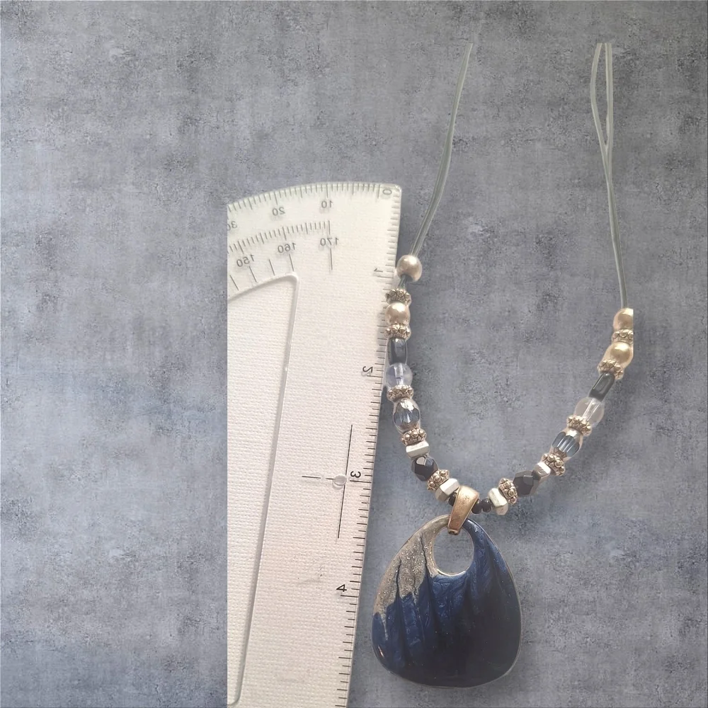 Gold Silver Black and Blur Necklace with Striking Pendant